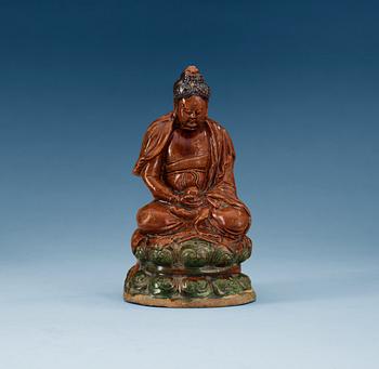1258. A ceramic figure of Buddha, Ming dynasty, 17th Century.