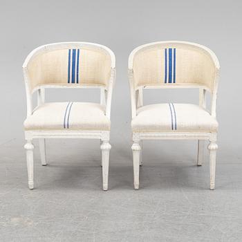 A pair of Gustavian style armchairs from around year 1900.
