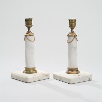 A PAIR OF CANDLESTICKS, brass and marble, gustavian late 18th century.