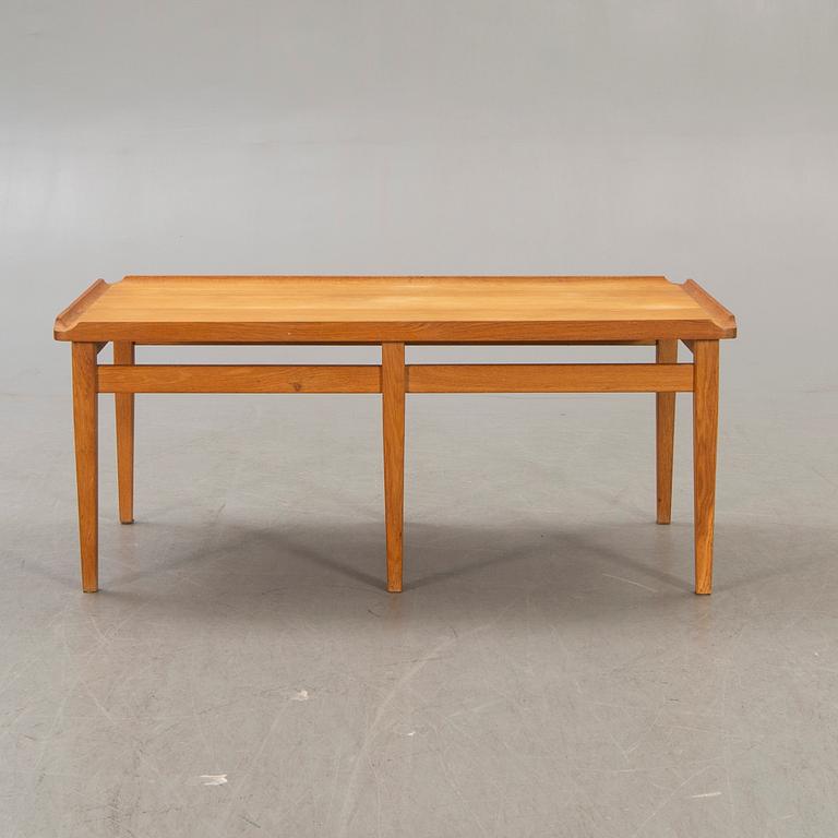 A 1960s oak coffee table.