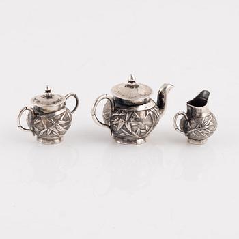 A Japanese Silver Minature Tea Service, probably early 20th Century, (3 pieces).