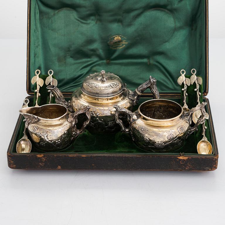 A 9-piece parcel-gilt sterling silver tea set, maker's mark of Samuel Smily, Goldsmiths Alliance Ltd, London 1873-74.