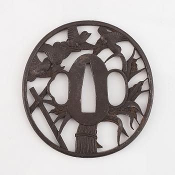 Three Japanese iron Tsubas, late Edo, one signed Kunihiro.