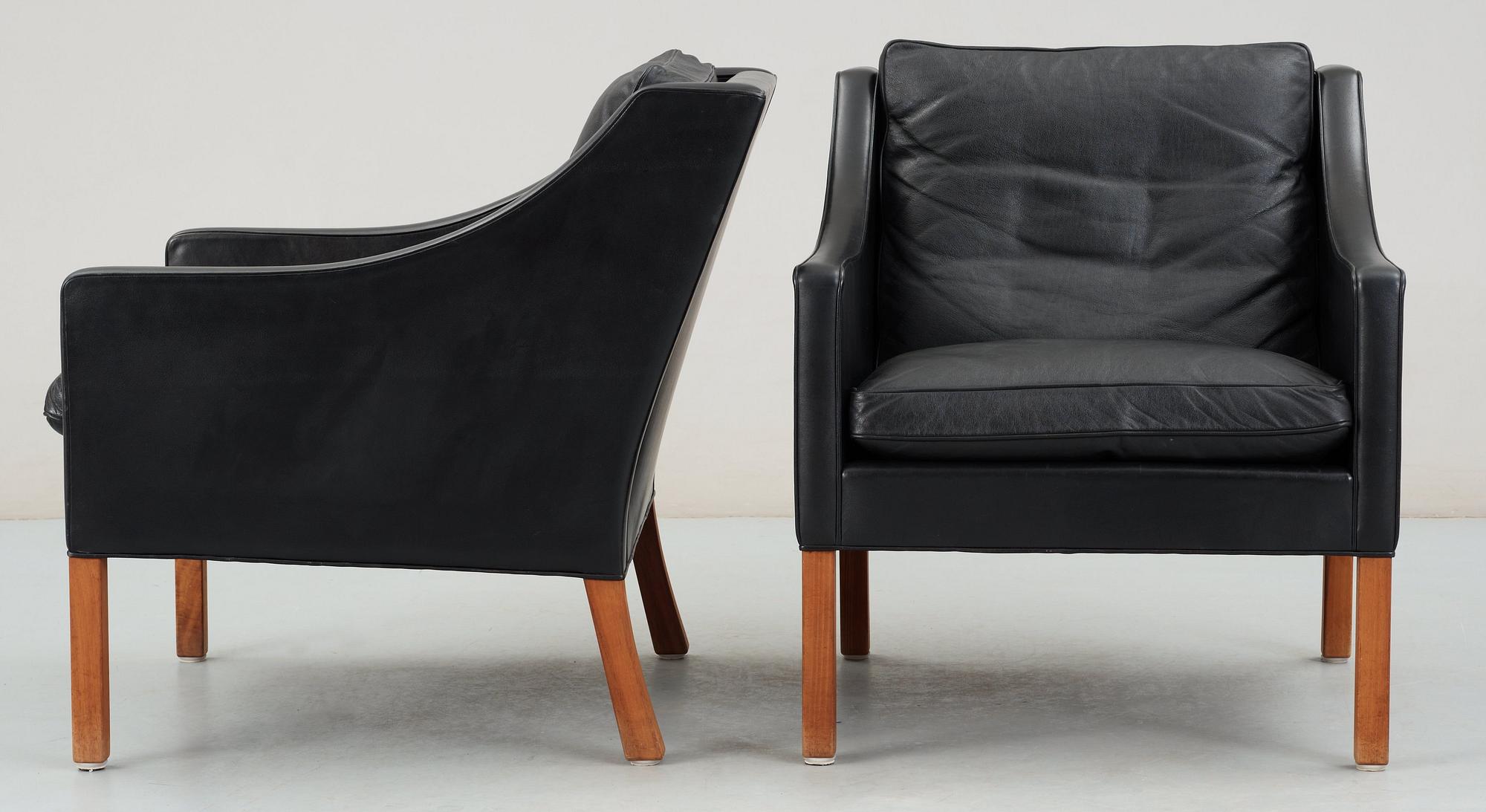 A pair of black leather Børge Mogensen armchairs, Fredericia, Denmark.