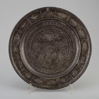 An 18th century pewter plate.