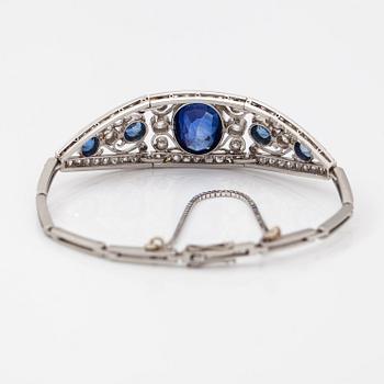 A platinum bracelet with old-cut diamonds ca. 1.46 ct in total, a synthetic sapphire and sapphires. Early 20th century.