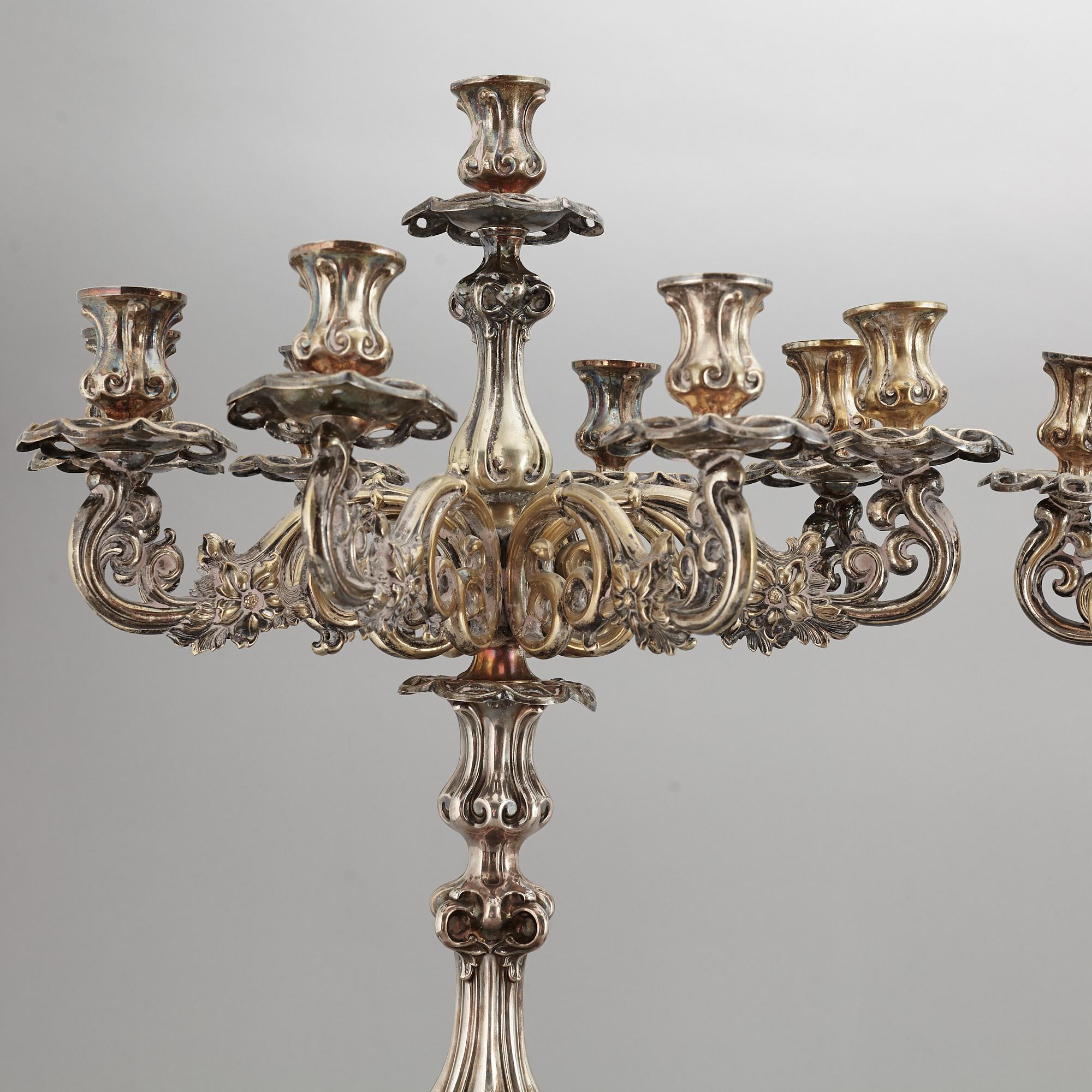 A pair of barocque style nine lights candelabra, silver plate, 20th Century.