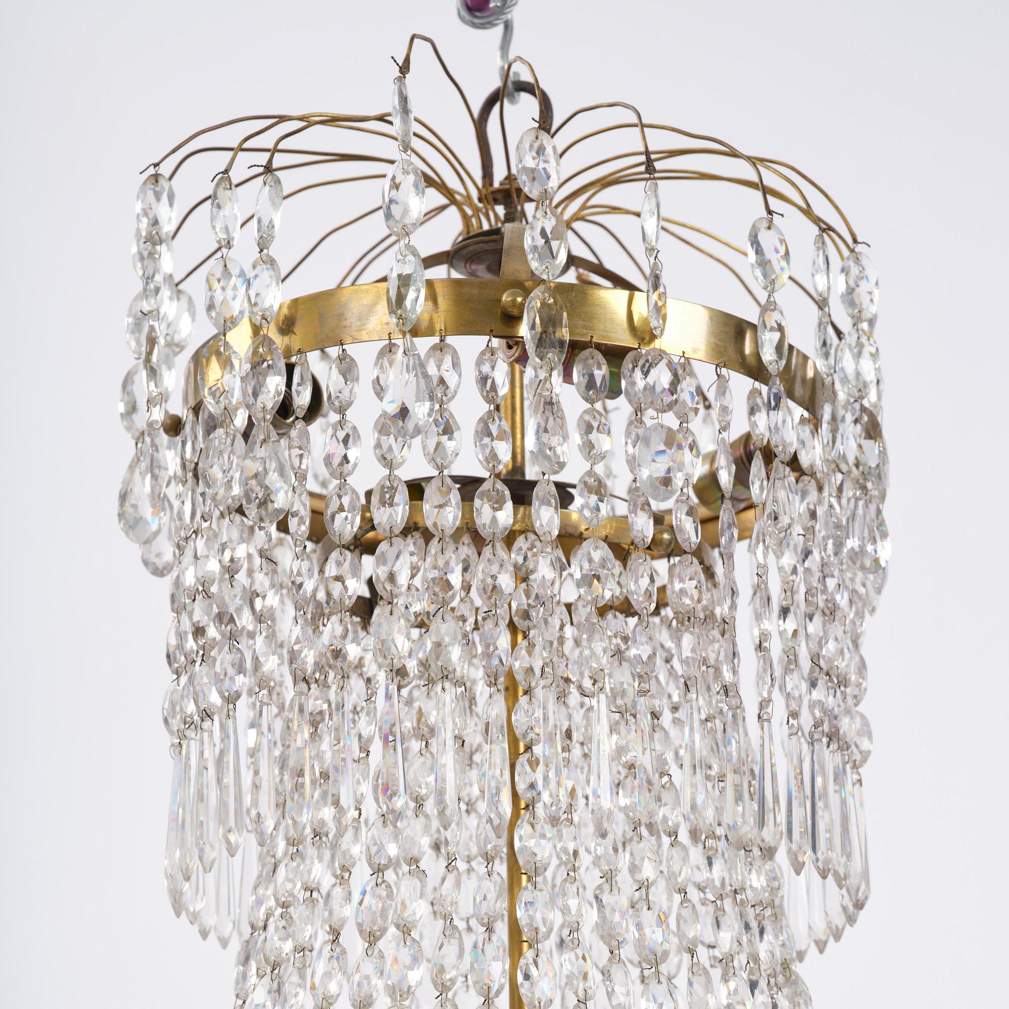 A Swedish late Empire gilt brass nine-light chandelier, 1830's.