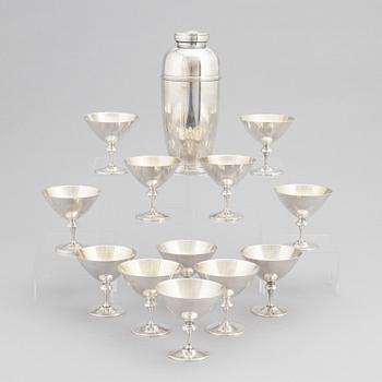 A silver plated shaker, C.G. Hallberg and a set of twelwe cocktail glasses, GAB, second half of the 20th Century.
