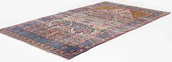 An antique Tehran carpet, north Persia, c. 323 x 195 cm.
