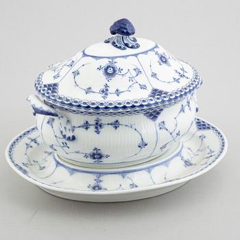 A porcelain 'Blue fluted half lace' / 'Musselmalet' tureen with cover and stand, Royal Copenhagen, 19th century.