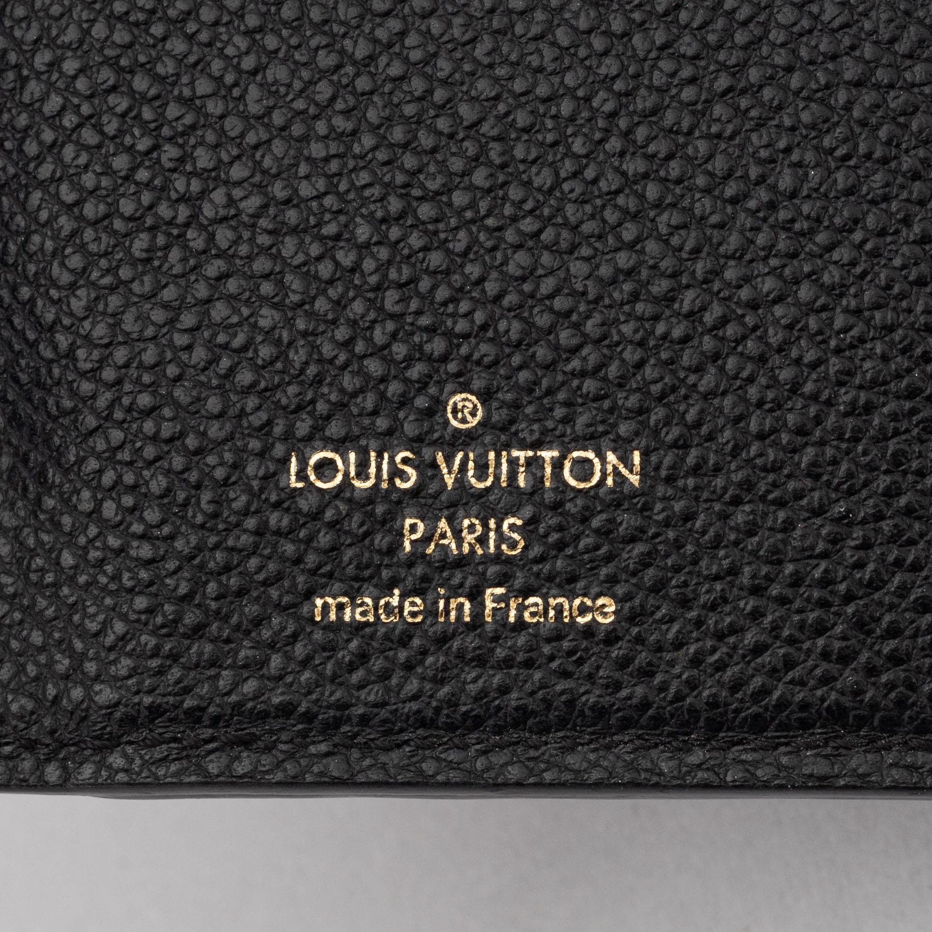 Louis Vuitton, a black Monogram Empreinte leather 'Curieuse' wallet, 2015.