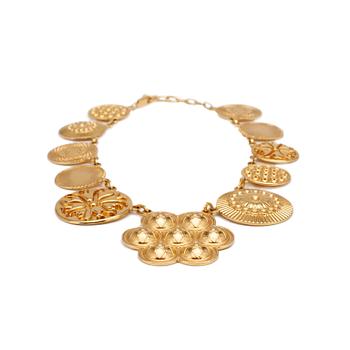 YVES SAINT LAURENT, a gold colored medallion necklace.