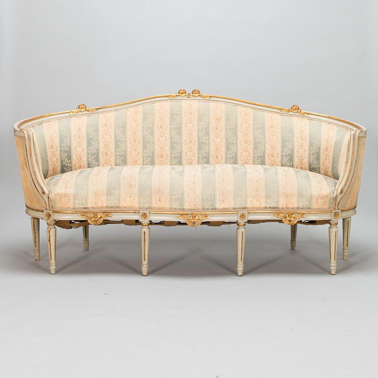 A Gustavian style sofa and table from early 20th century.