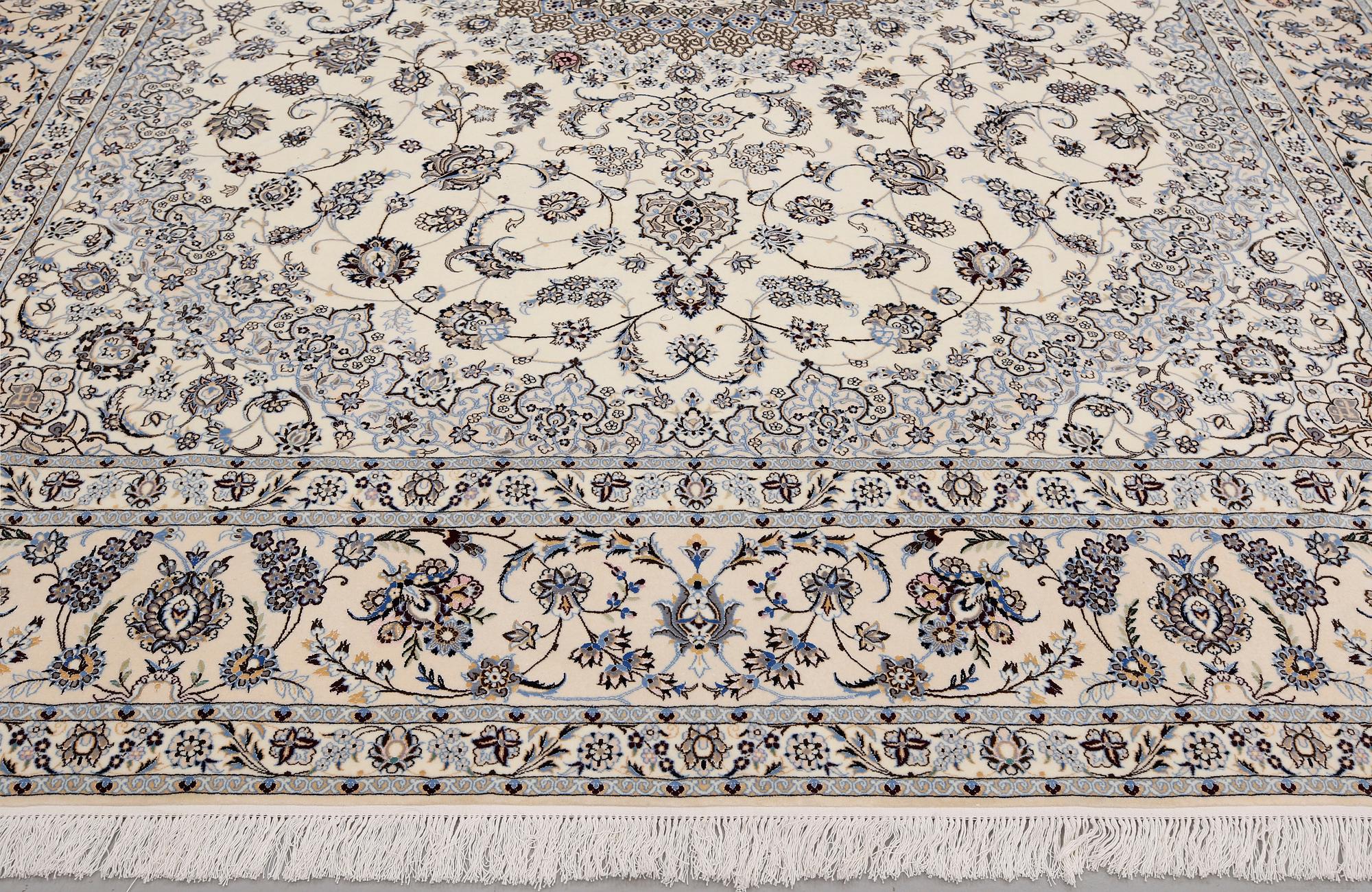 A Nain part silk carpet, 408 x 308 cm.