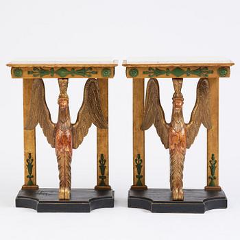 A pair of giltwood console tables, Empire-style incorporating older elements.