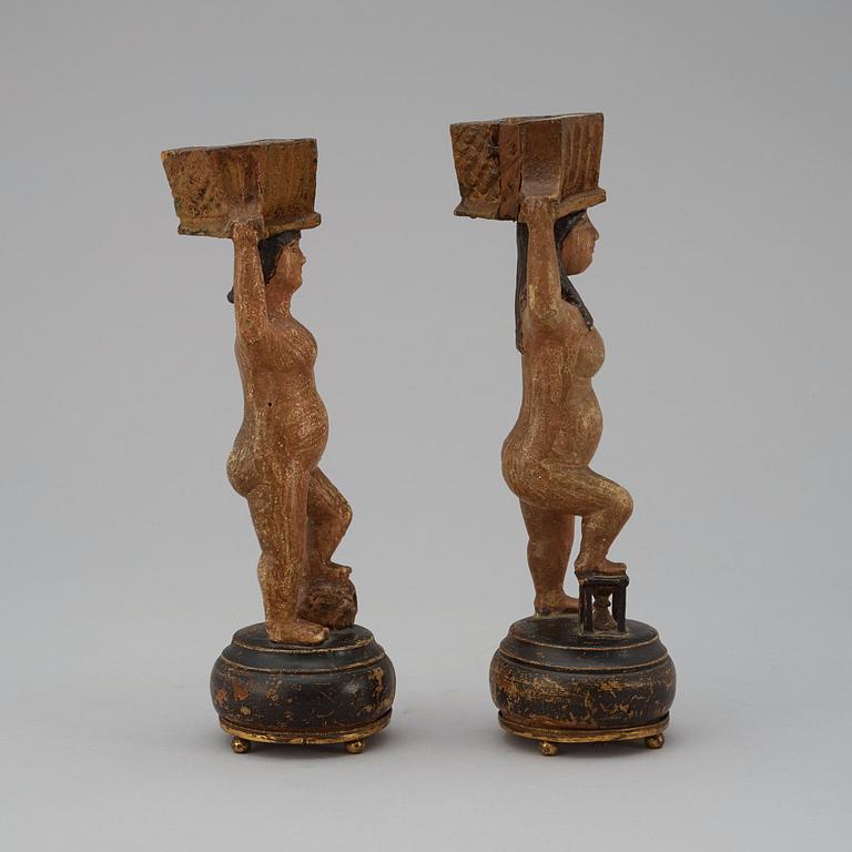 A pair of Swedish 19th century wooden candlesticks.