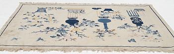 A semi-antique pictoral Chinese rug, approx. 240 x 170 cm.