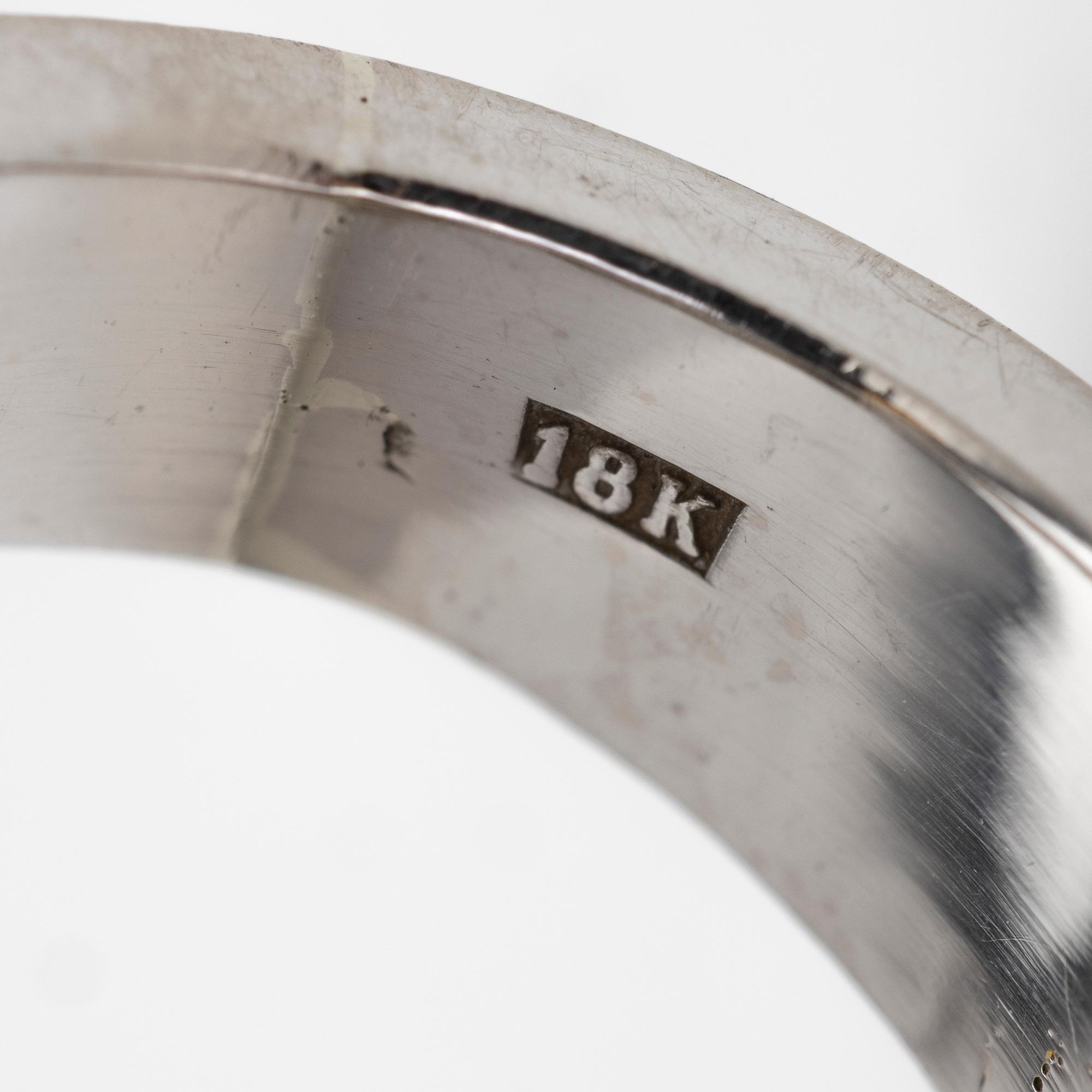 18K white gold ring with diamonds.