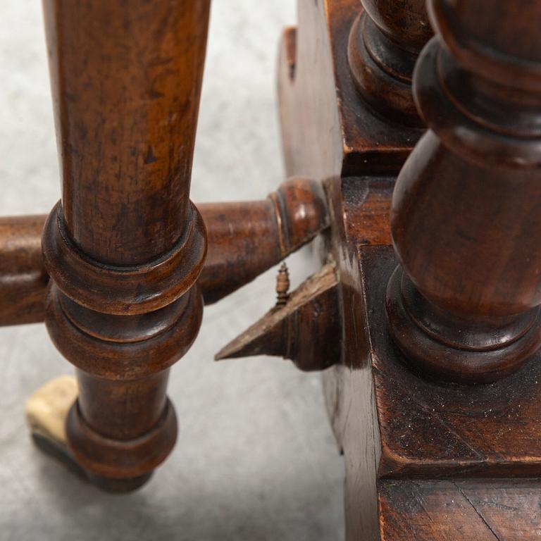 A 19th Century drop leaf table.