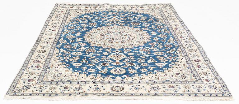 A Nain carpet, circa 310 x 196 cm.