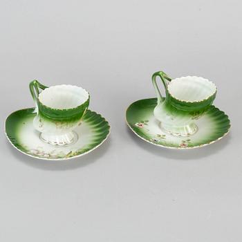 A pair of Russian porcelain cups and saucers, Kuznetsov, circa 1900.