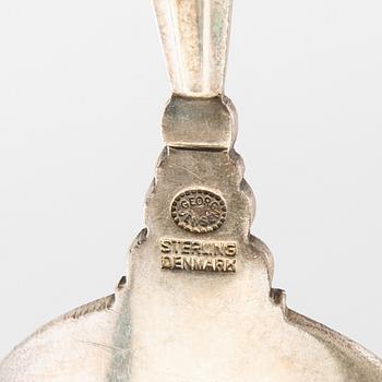 Johan Rohde, serveringsskedar 13 st "Konge/Achorn" sterlingsilver för Georg Jensen efter 1945.
