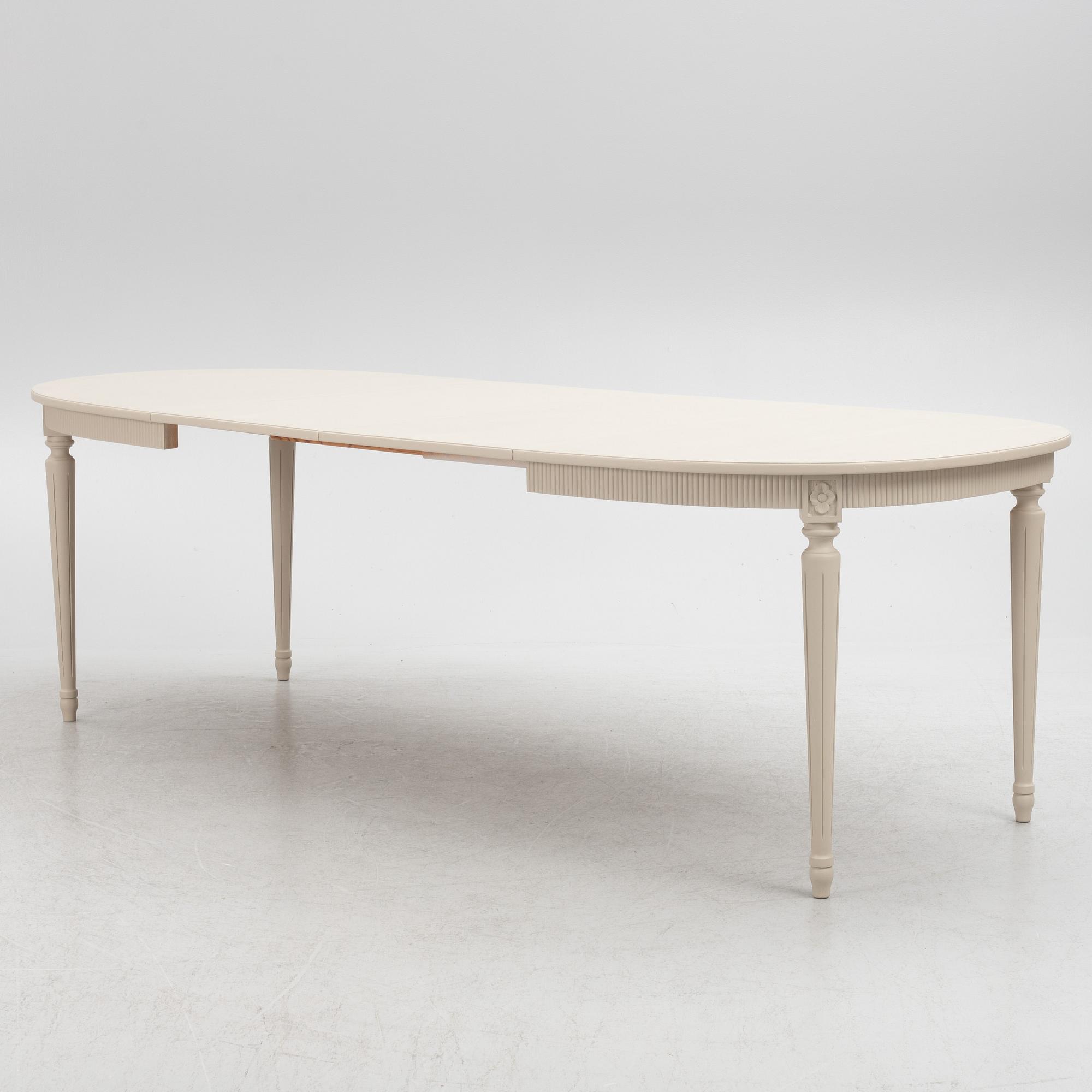 A Gustavian Style Dining Table and 10 Chairs, second half of the 20th Century.