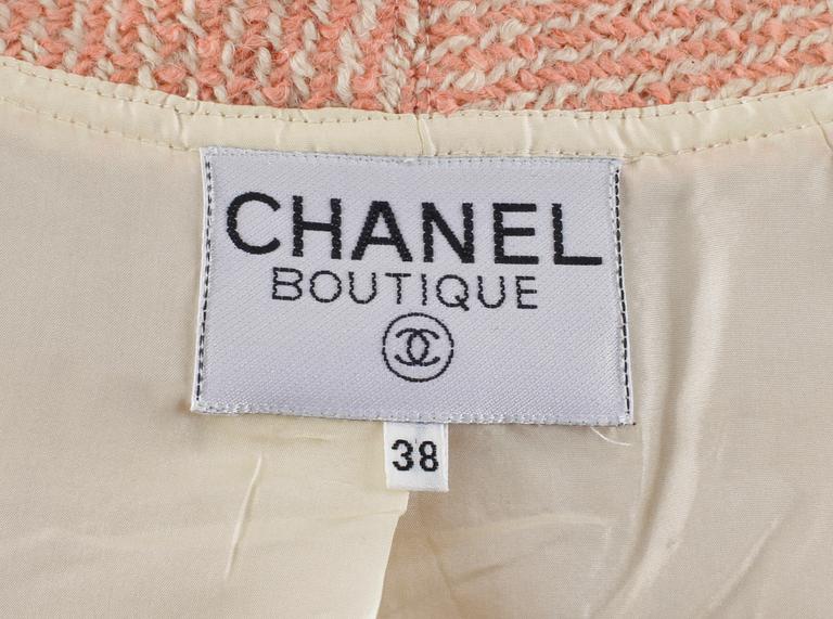 A pink/white bouclé jacket by Chanel.