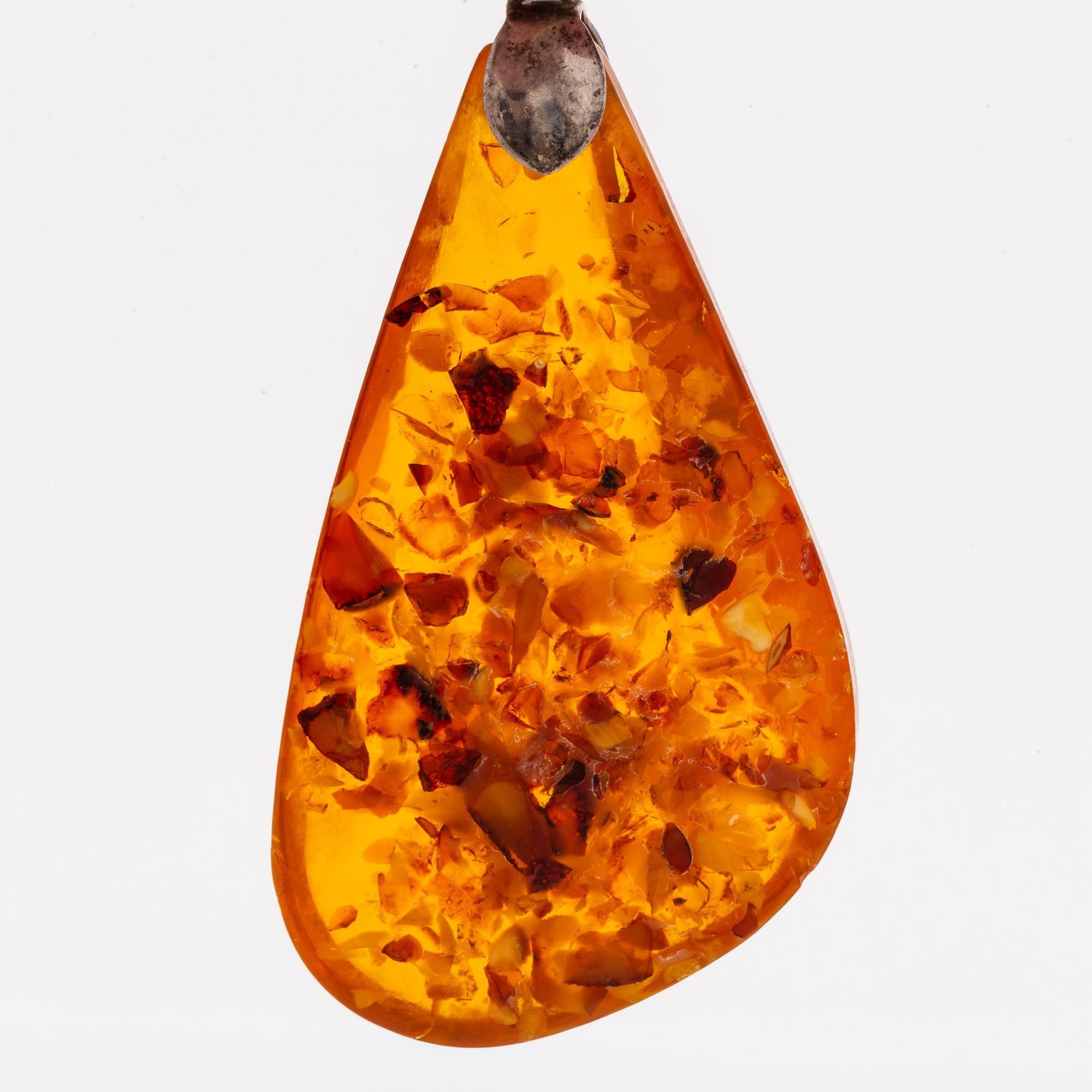 Amber set in silver, pendant, ring and earrings.