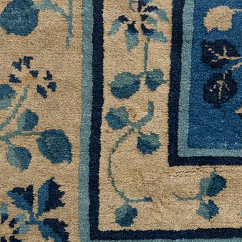 An antique Chinese carpet, c. 355 x 270 cm.