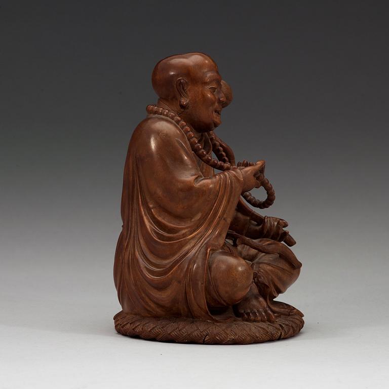 A Chinese wooden figure of a daoist dignitary.