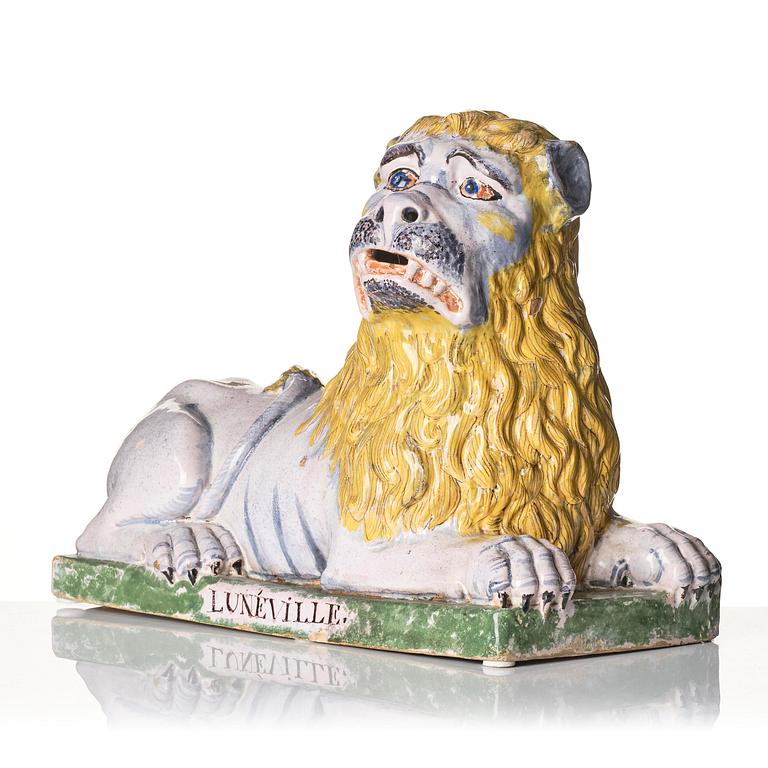 A pair of Luneville recumbent lions, circa 1780-1800.