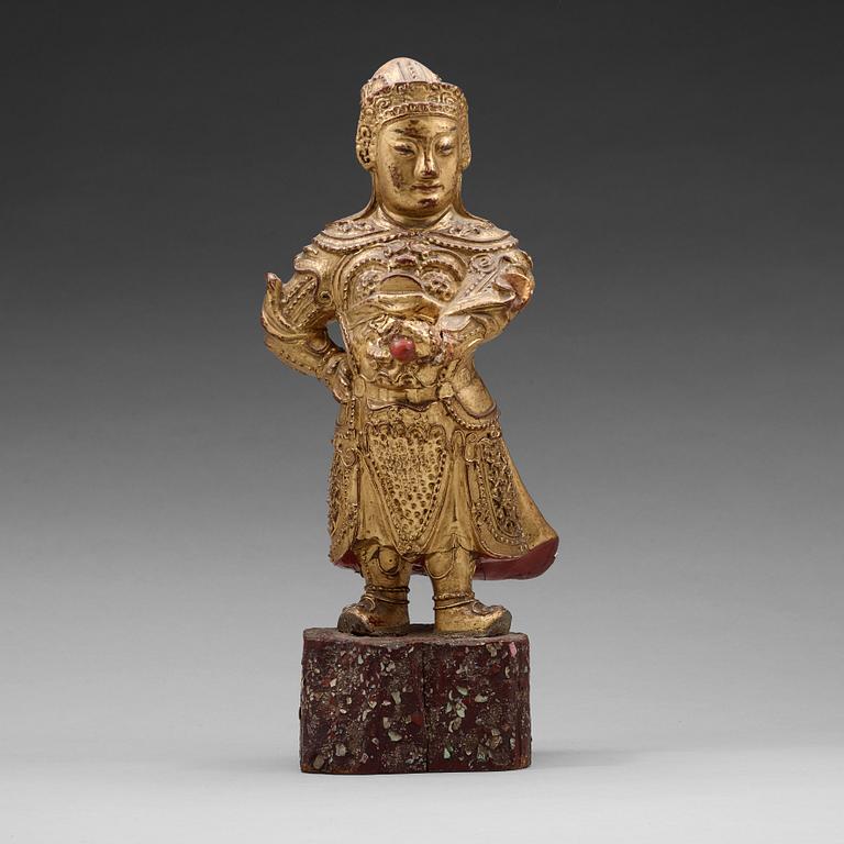 A wood sculpture of a guardian figure, (1644-1912).