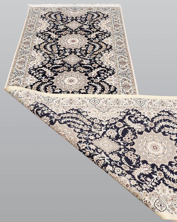 A Nain runner carpet, part silk Sk 6LAA, 337 x 103 cm.