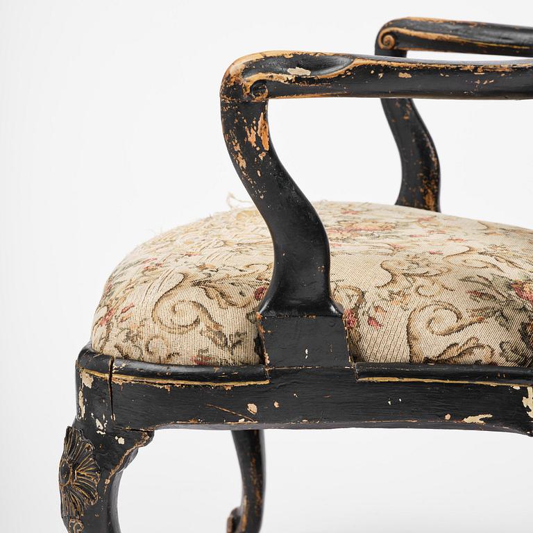 A pair of rococo armchairs in the manner of C. M. Sandberg, later part 18th century.