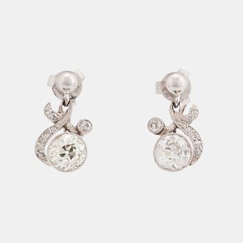 406. A pair of 18K white gold earrings set with old-cut diamonds.