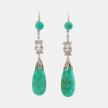 A pair of platinum earrings with amazonite.