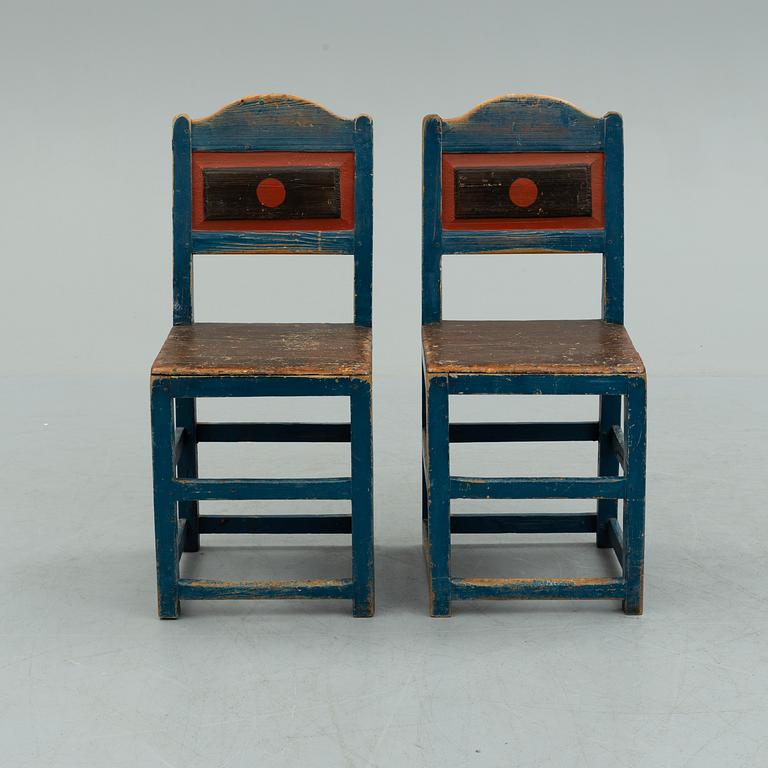 a pair of early 20th century chairs.
