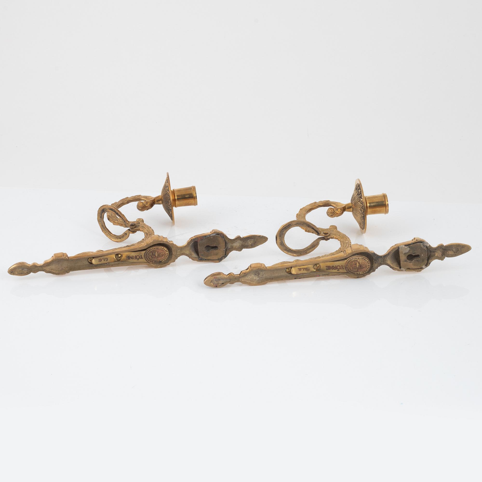 A pair of 'Törne' brass one-light wall ligths from IKEA's 18th Century collection.