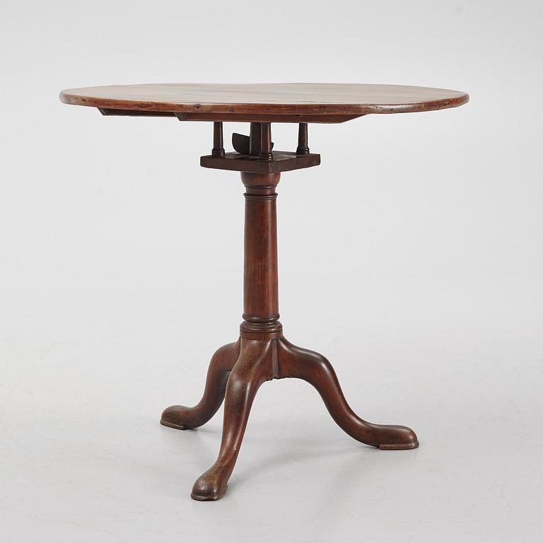 A drop-leaf table, England, 19th Century.