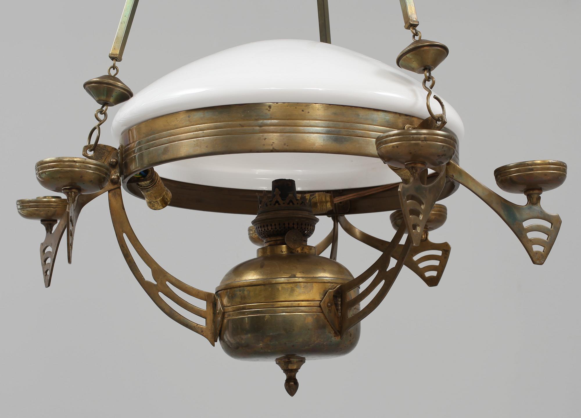 TAKFOTOGENLAMPA, jugend, 1900-talets första kvartal.