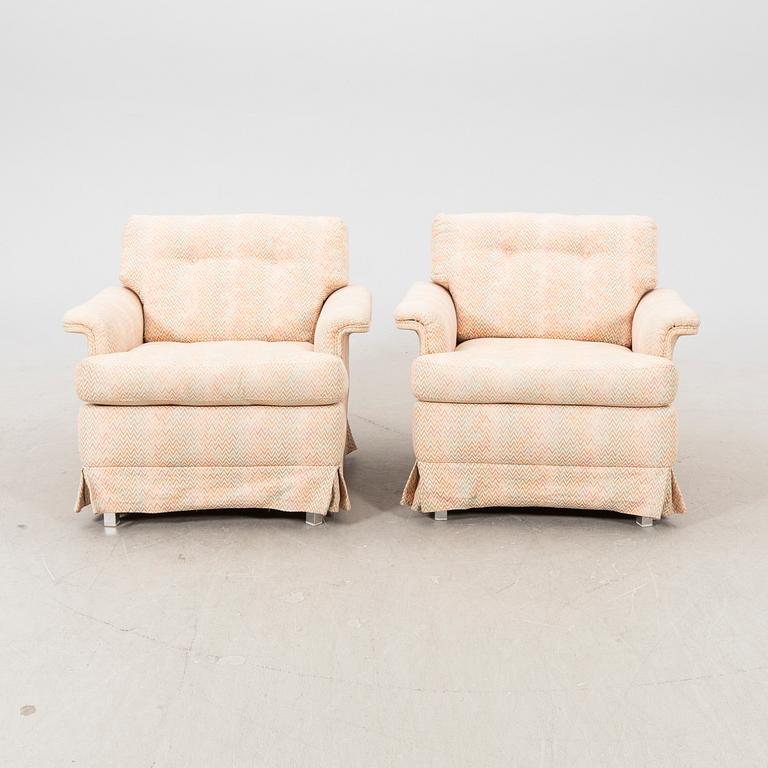 A pair of DUX 1960770s armchairs.