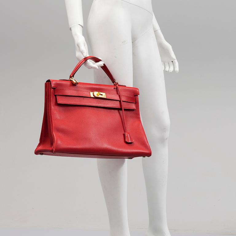 A red Epson "Kelly 40" bag by Hermès 1991.