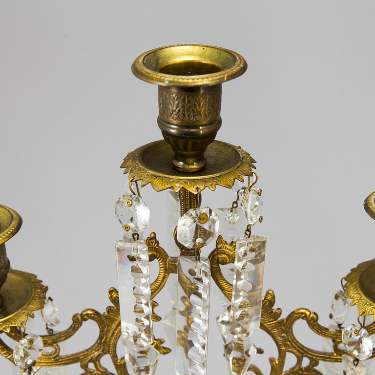 A pair of late 19th Century gilt candelabra.