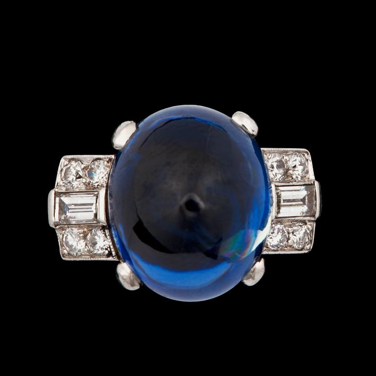 A untreated cabochon-cut sapphire, 12.88 cts, and diamond ring.