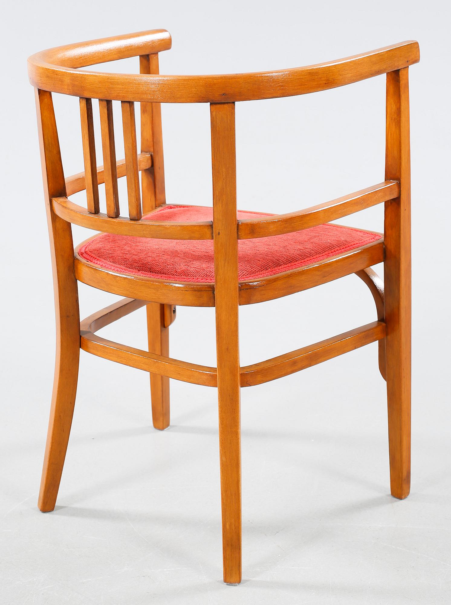 A table and a arm chair from the second quarter of the 20th century.