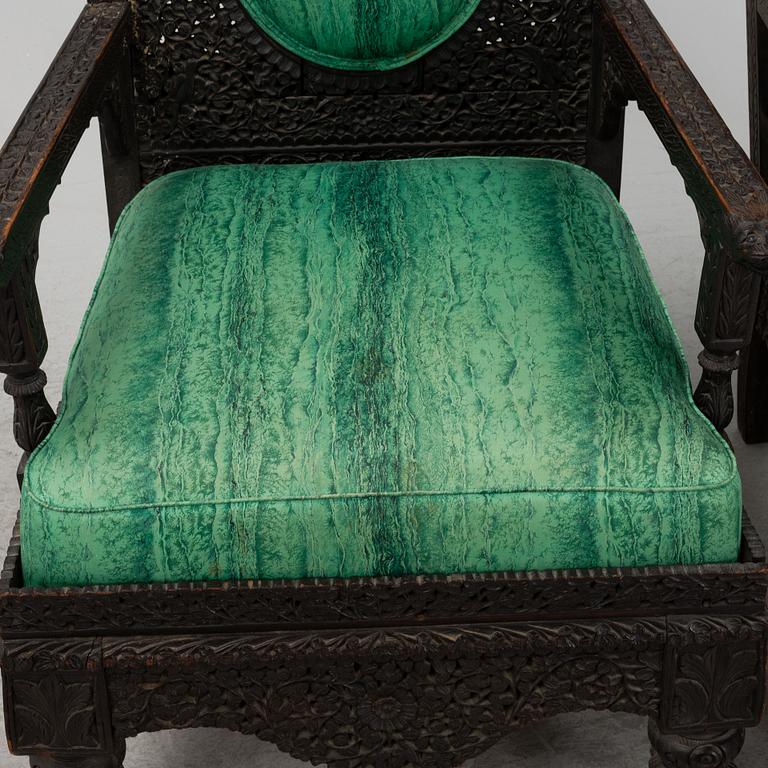 A pair of Angloindian carved chairs, India, 19th century, in so called 'Bombay style'.