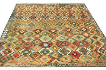A Kilim carpet, c. 295 x 261 cm.