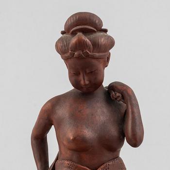 A pottery figure of a seated woman, Japan, Taisho period (1912-26), signed Sais.